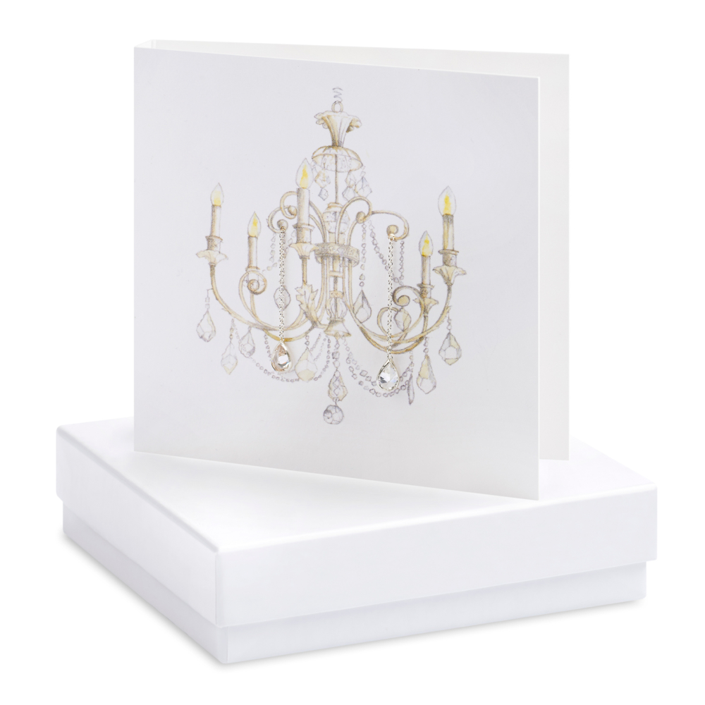 silver earrings on card chandelier by crumble and core