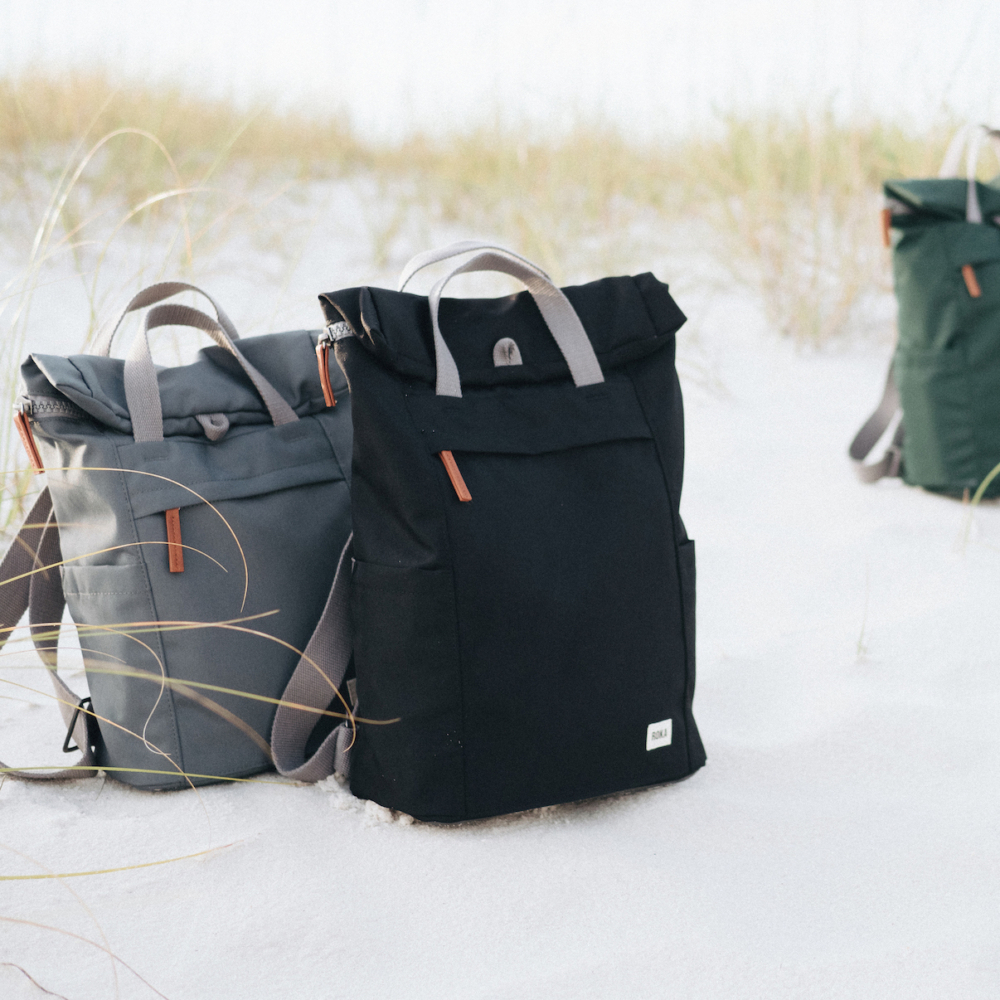 Roka sustainable backpack on sand dunes
