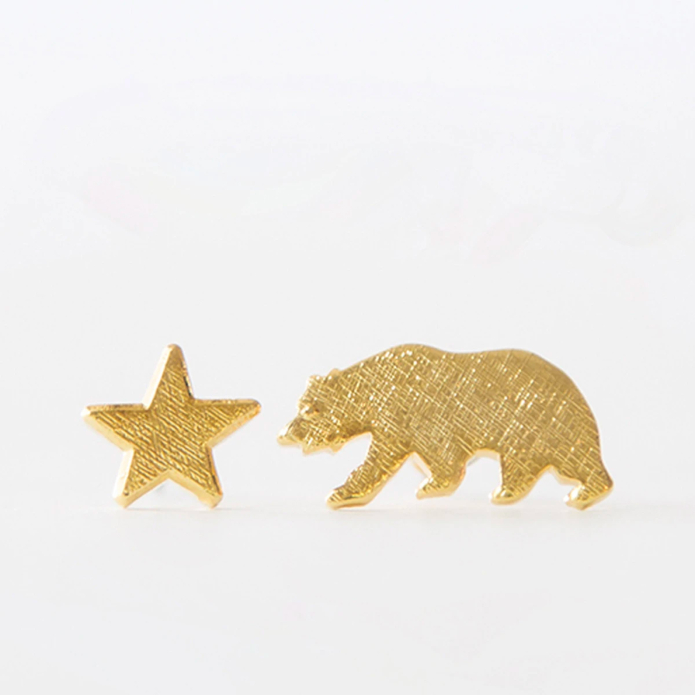 mis-matched gold earrings bear and star by YOW
